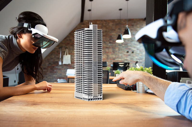 Team discuss city planning utilizing augmented reality headsets