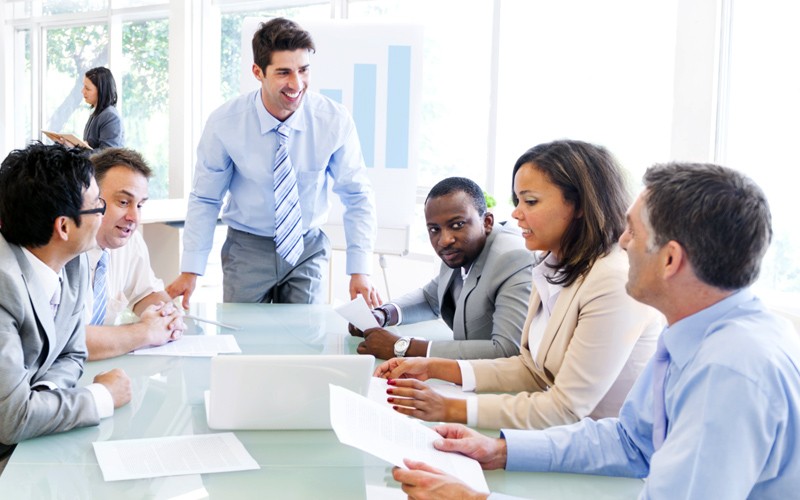 Team around desk discussion