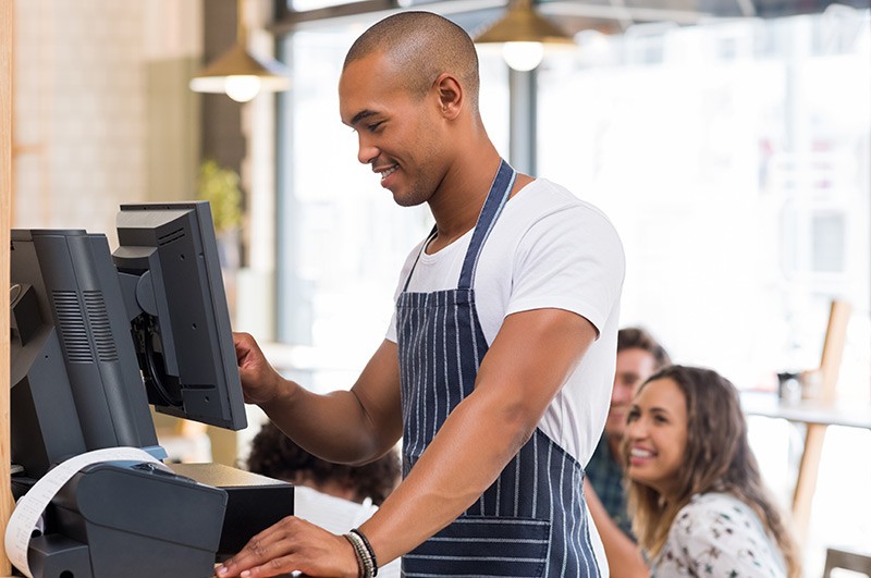 Small business owner using POS system